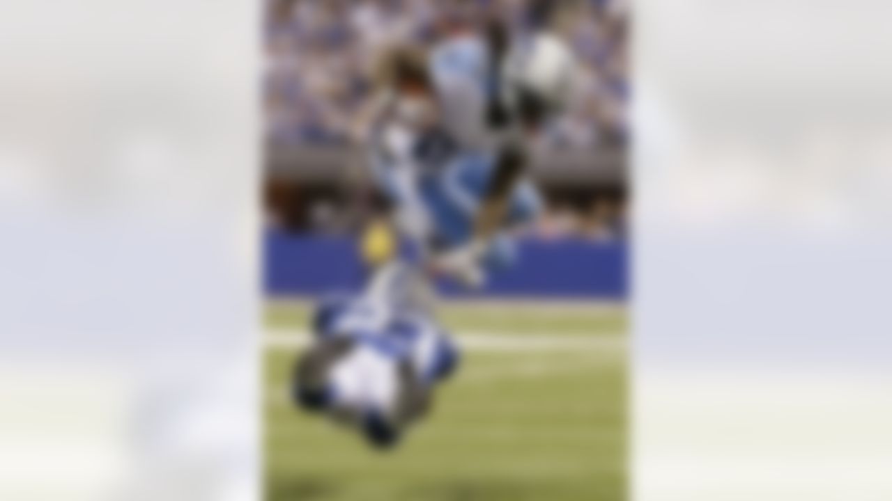 Tennessee Titans' Chris Johnson (28) is tackled by Indianapolis Colts' Vontae Davis (23) during the second half of an NFL football game, Sunday, Dec. 9, 2012, in Indianapolis. (AP Photo/Jeff Roberson)