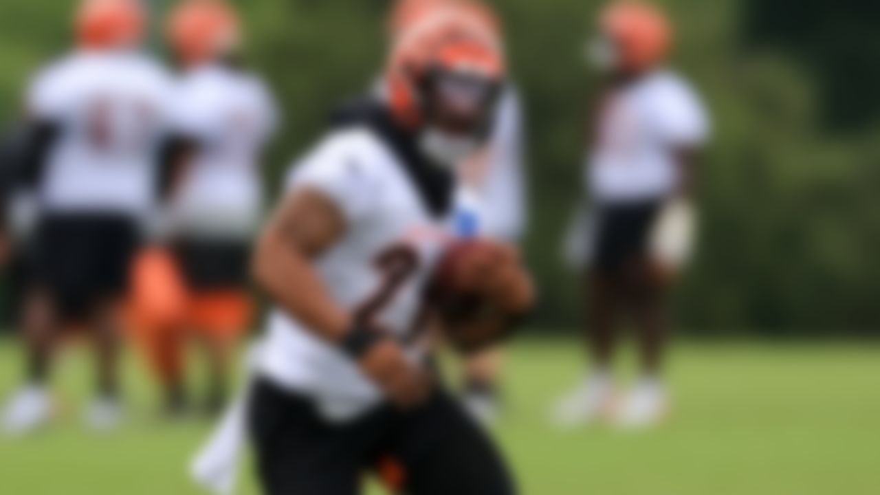 Cincinnati Bengals' Joe Mixon carries the ball during an NFL football camp practice in Cincinnati, Tuesday, June 8, 2021.
