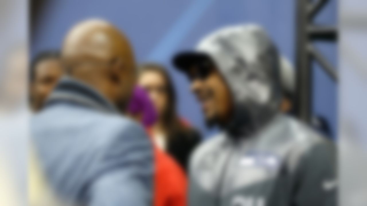Seattle Seahawks running back Marshawn Lynch, right, speaks with NFL Network's Deion Sanders during the Super Bowl XLVIII Media Day at the Prudential Center on Tuesday, January 28, 2014 in Newark, NJ. (Perry Knotts/NFL)