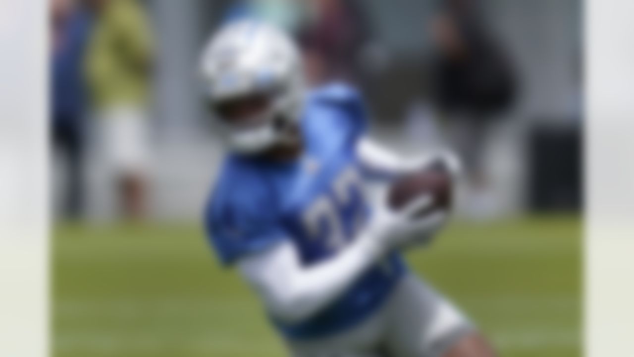 Detroit Lions running back D'Andre Swift runs after a catch during NFL football practice in Allen Park, Mich., Thursday, June 3, 2021.