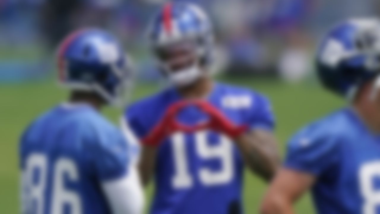 New York Giants wide receivers Kenny Golladay (19) and Darius Slayton (86) talk during an NFL football practice, Thursday, June 10, 2021, in East Rutherford, N.J.