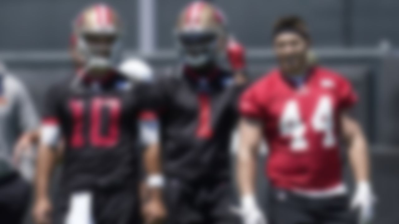 San Francisco 49ers quarterback Jimmy Garoppolo (10) smiles next to quarterback Josh Johnson (1) and fullback Kyle Juszczyk (44) at the team's NFL football training facility in Santa Clara, Calif., Tuesday, May 25, 2021.