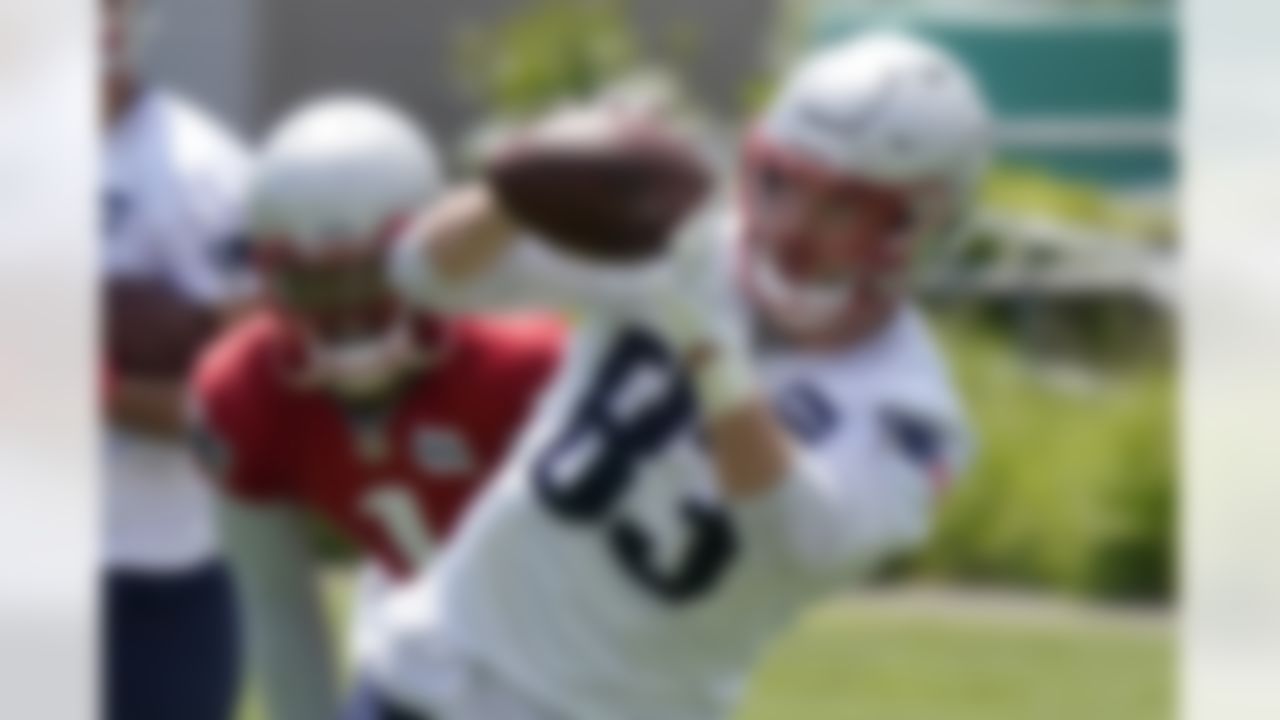 New England Patriots tight end Matt LaCosse (83) makes a catch as quarterback Cam Newton (1) looks on during NFL football practice in Foxborough, Mass., Thursday, May 27, 2021.