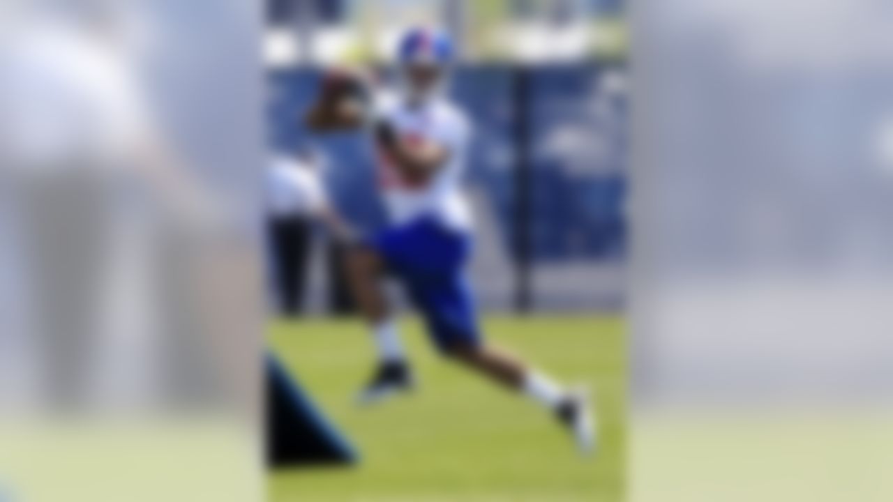 Wide receiver Rueben Randle (82), second-round draft pick, catches a pass during football drills at the New York Giants rookie minicamp in East Rutherford, N.J., Saturday, May 12, 2012. (AP Photo/Mel Evans)