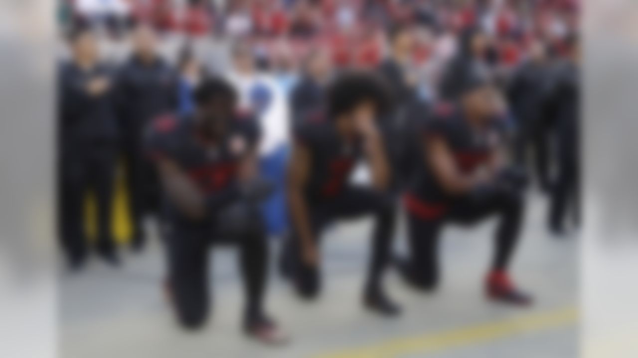 San Francisco 49ers outside linebacker Eli Harold (58), quarterback Colin Kaepernick (7) and safety Eric Reid (35) kneel during the national anthem before the team's NFL football game against the Arizona Cardinals in Santa Clara, Calif., Thursday, Oct. 6, 2016. (AP Photo/Marcio Jose Sanchez)