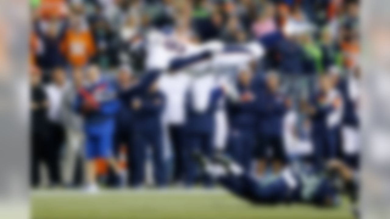 Denver Broncos tight end Marcel Jensen (89) is tackled by Seattle Seahawks safety Ty Zimmerman (30) during the NFL preseason game on Friday, Aug. 14, 2015 in Seattle. (Ric Tapia/NFL)