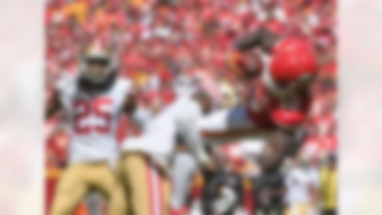 Kansas City Chiefs wide receiver Tyreek Hill (10) makes a catch against San Francisco 49ers defensive back Adrian Colbert (27) as 49ers cornerback Richard Sherman (25)] watches during the first half of an NFL football game in Kansas City, Mo., Sunday, Sept. 23, 2018. (AP Photo/Ed Zurga)
