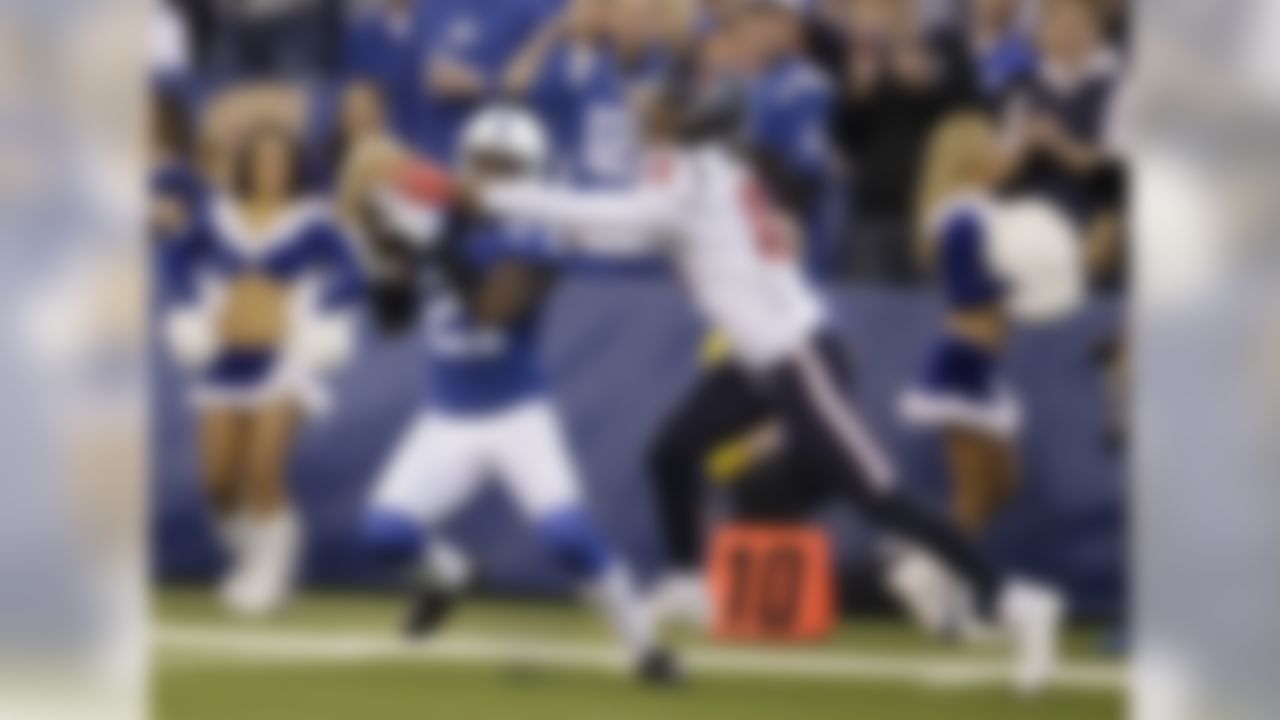 Indianapolis Colts' Vontae Davis (21) makes an interception while defending Houston Texans' DeAndre Hopkins (10) during the first half of an NFL football game Sunday, Dec. 20, 2015, in Indianapolis. (AP Photo/Darron Cummings)