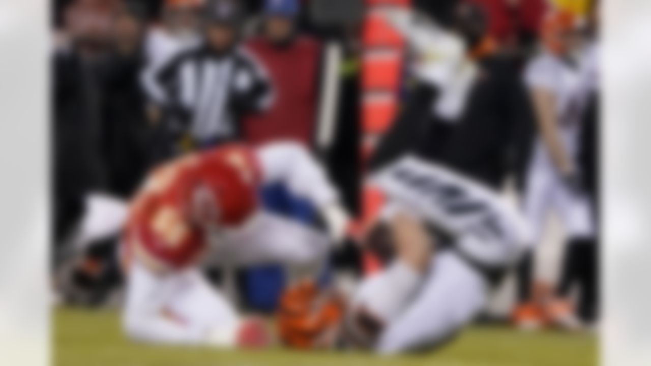Cincinnati Bengals quarterback Joe Burrow is sacked by Kansas City Chiefs defensive end Frank Clark (55) during the first half of the NFL AFC Championship playoff football game, Sunday, Jan. 29, 2023, in Kansas City, Mo. (AP Photo/Ed Zurga)