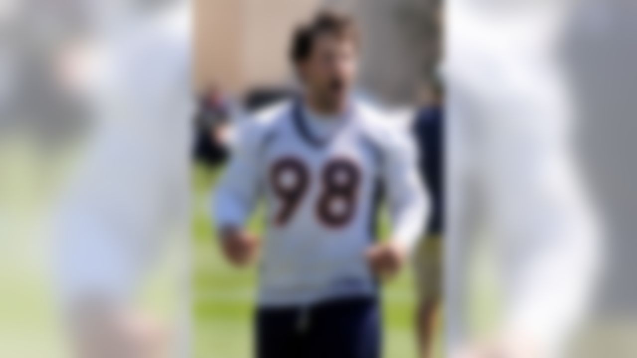 ENGLEWOOD, CO - JUNE 12: Defensive tackle Josh Mallard #98 of the Denver Broncos goes through stretching exercises during mini camp on June 12, 2008 at the Bronco training facility in Englewood, Colorado.  (Photo by Steve Dykes/Getty Images)