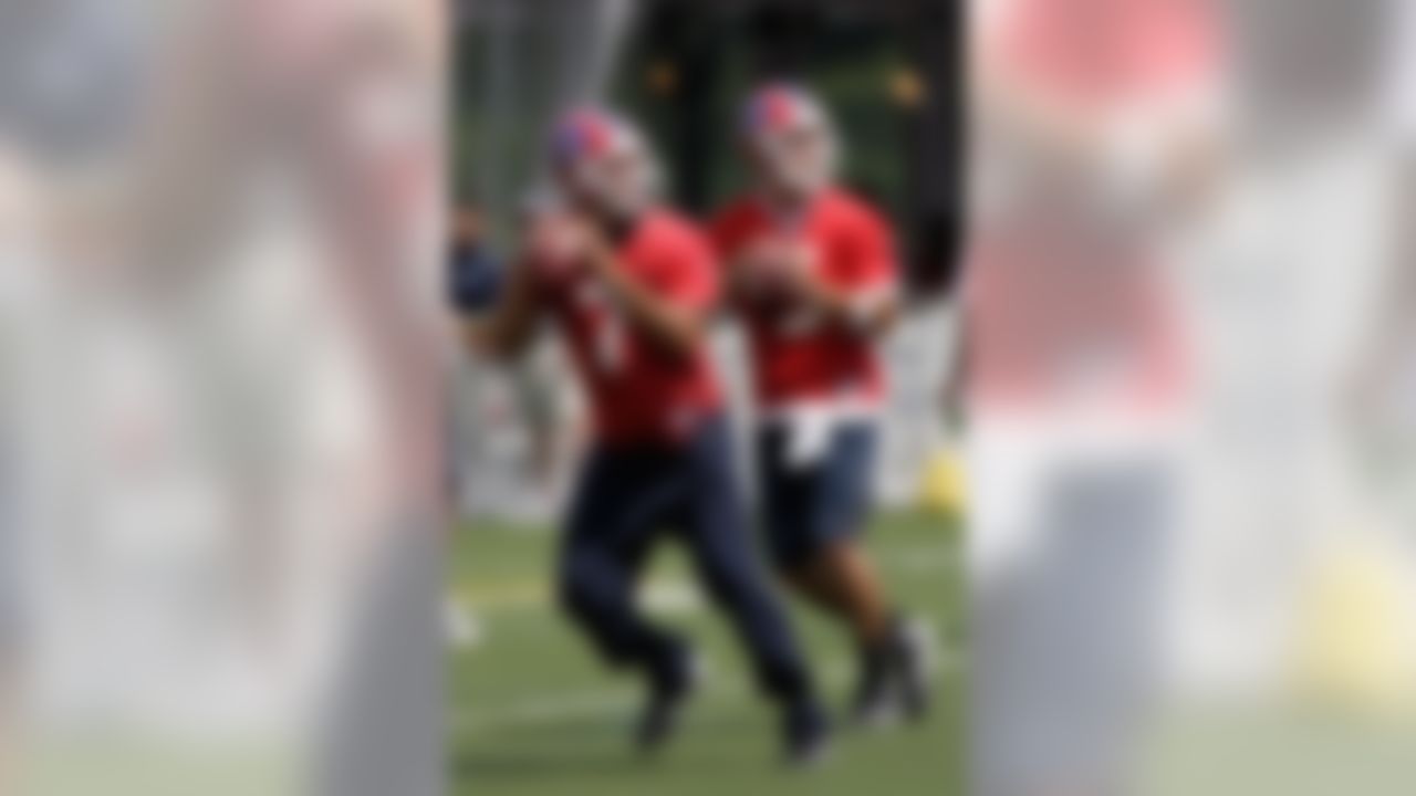 PITTSFORD, NY - JULY 25: JP Losman #7 and Trent Edwards #5  of the Buffalo Bills drop back to pass during Training Camp on July 25, 2008 at Saint John Fisher College in Pittsford, New York.  (Photo by Rick Stewart/Getty Images)