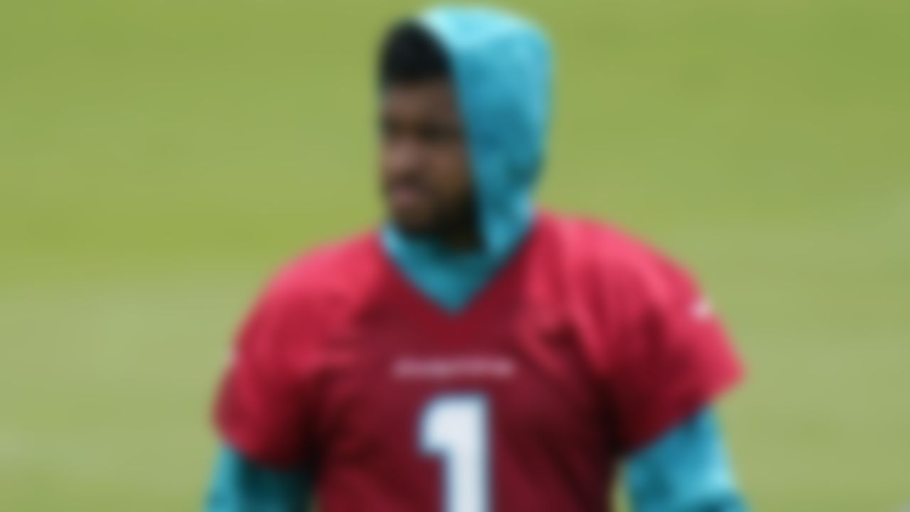 Miami Dolphins quarterback Tua Tagovailoa (1) works out at the team's NFL football training facility, Wednesday, May 26, 2021, in Davie, Fla.