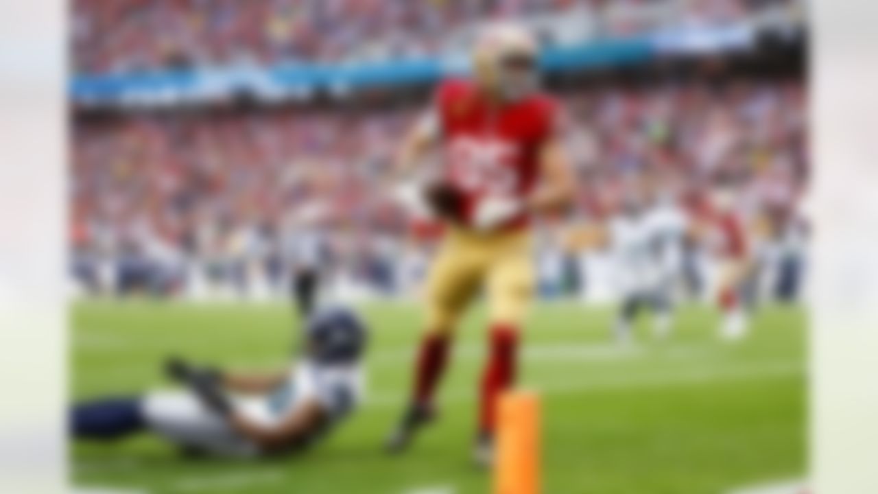 San Francisco 49ers tight end George Kittle (85) celebrates after scoring a two-point conversion during an NFL Super Wild Card Weekend playoff game against the Seattle Seahawks on Saturday, January 14, 2023 in Santa Clara, California.