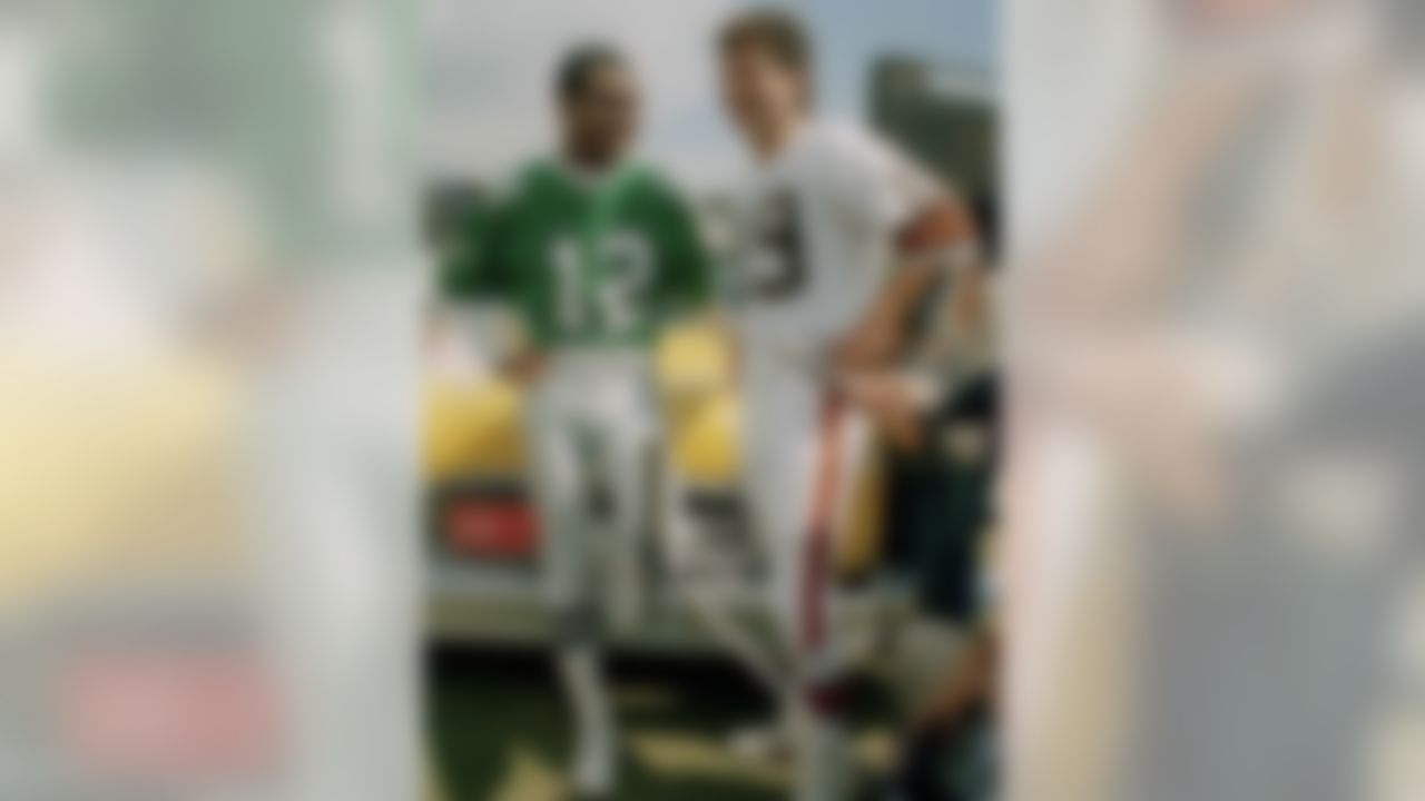 Philadelphia Eagles quarterback Randall Cunningham, left, and Cleveland Browns' quarterback Bernie Kosar shown together during a training session at Crystal Palace in London, Aug. 1, 1989. (AP Photo/Gill Allen)