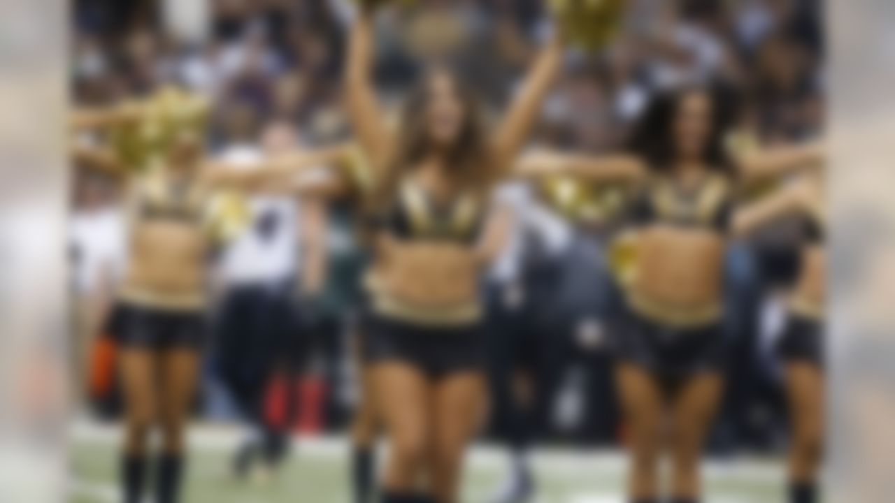 New Orleans Saints cheerleaders perform in the first half of an NFL football game against the Baltimore Ravens in New Orleans, Monday, Nov. 24, 2014. (AP Photo/Jonathan Bachman)