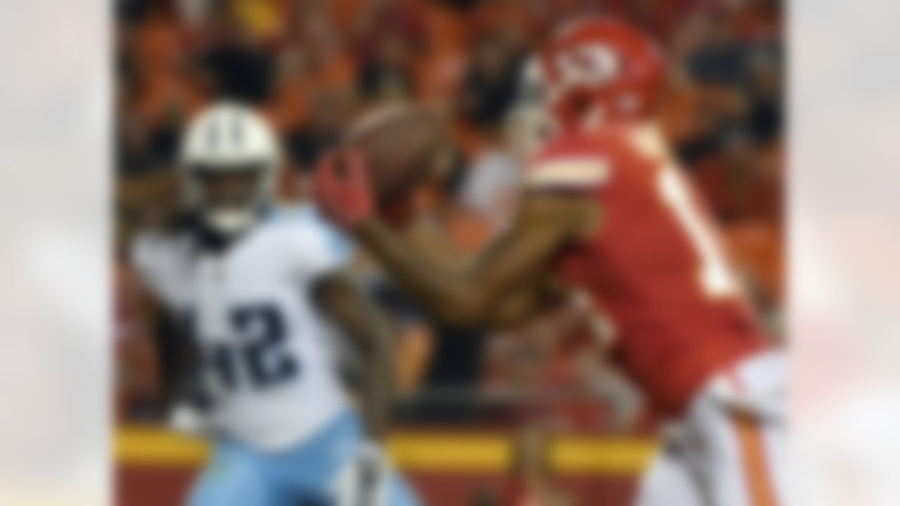 Kansas City Chiefs wide receiver Demarcus Robinson (14) makes a touchdown catch in front of Tennessee Titans safety Denzel Johnson (42)] during the first half of an NFL preseason football game in Kansas City, Mo., Thursday, Aug. 31, 2017. (AP Photo/Ed Zurga)