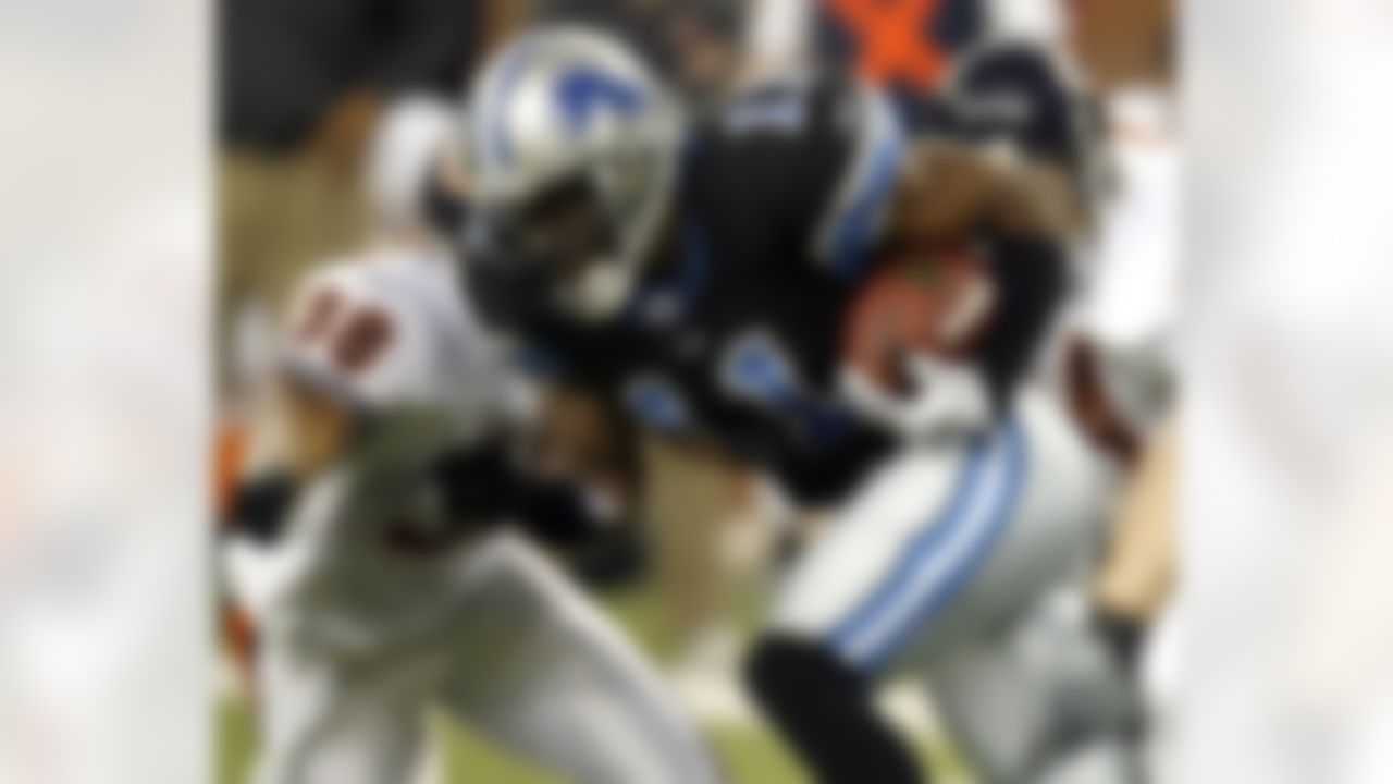DETROIT - DECEMBER 24: Roy Williams #11 of the Detroit Lions tries to get past the tackle of Danieal Manning #38 of the Chicago Bears during fouth quarter action on December 24, 2006 at Ford Field in Detroit, Michigan. Chicago won the game 26-21. Photo by Getty Images.