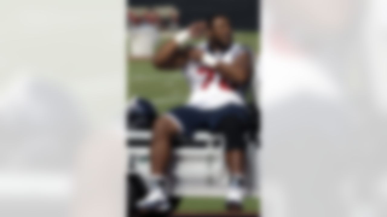 Houston Texans offensive tackle Duane Brown rides on the back of a cart during a NFL football workout Tuesday, May 25, 2010, in Houston. (AP Photo/David J. Phillip)
