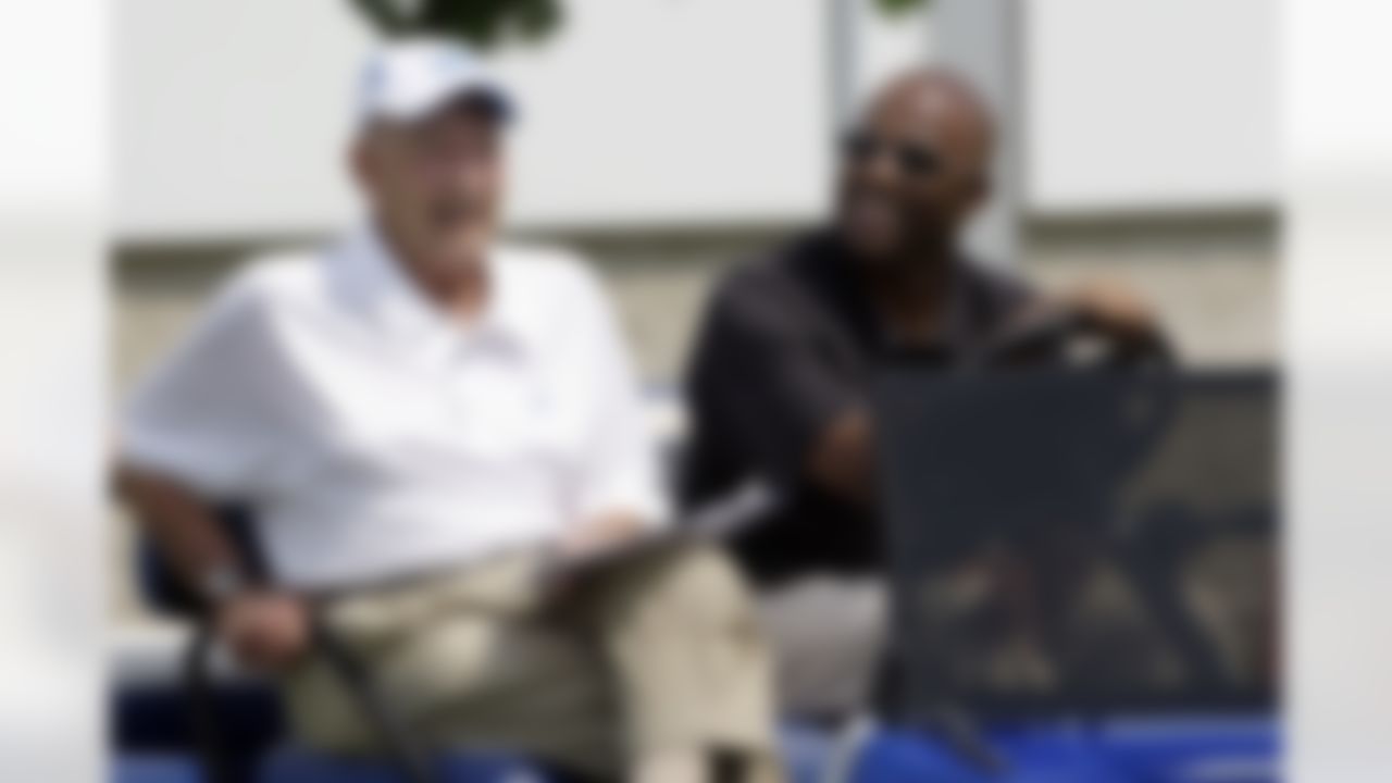 Detroit Lions owner William Clay Ford Sr., left, and general manager Martin Mayhew watch during NFL football minicamp Wednesday, June 24, 2009, in Allen Park, Mich. (AP Photo/Paul Sancya)