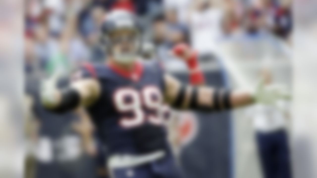 Houston Texans' J.J. Watt yells to the Tennessee Titans bench during the first half of an NFL football game Sunday, Nov. 30, 2014, in Houston. (AP Photo/David J. Phillip)