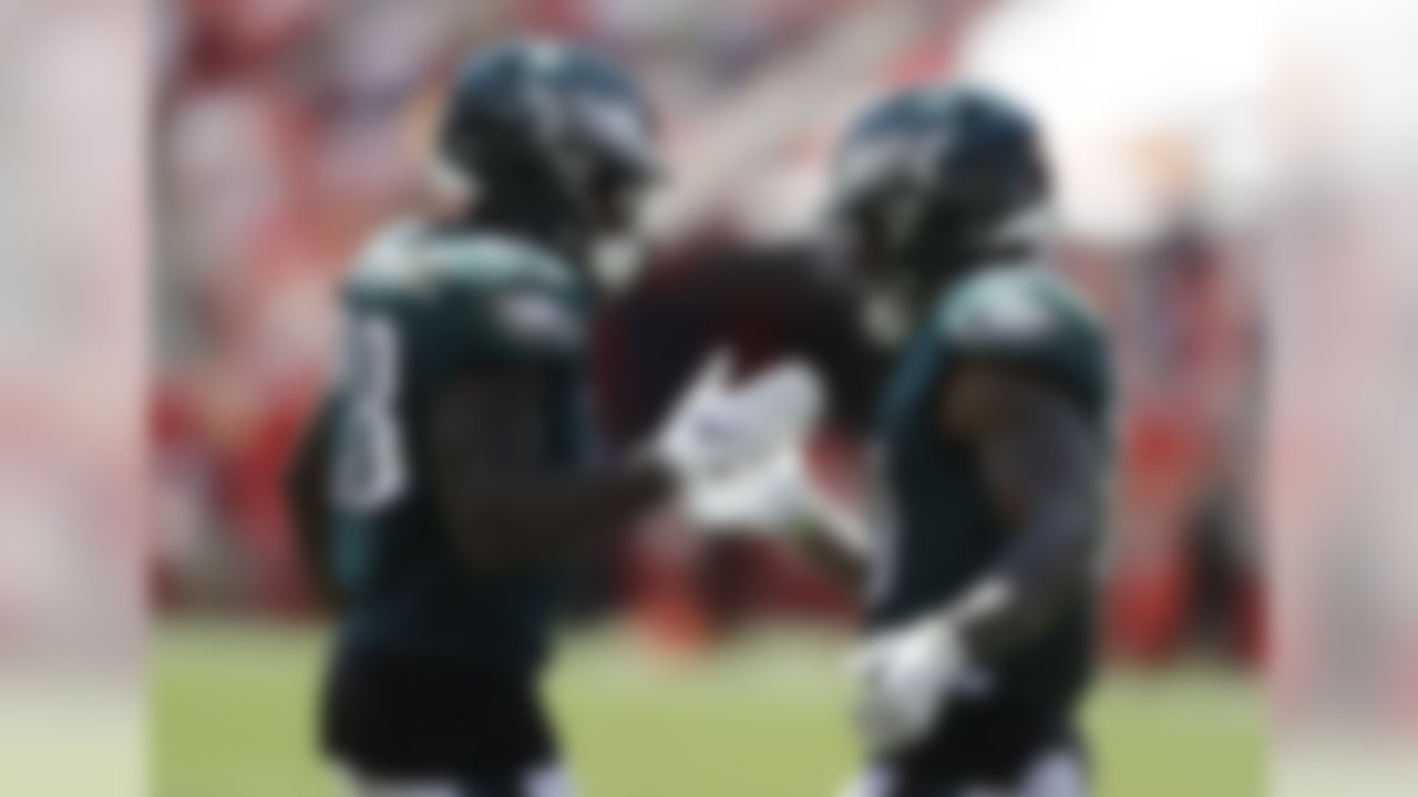 Philadelphia Eagles running back Corey Clement (30) in congratulated by running back Wendell Smallwood (28) after Clement scored a touchdown, during the first half of an NFL football game against the Tampa Bay Buccaneers, Sunday, Sept. 16, 2018, in Tampa, Fla. (AP Photo/Chris O'Meara)