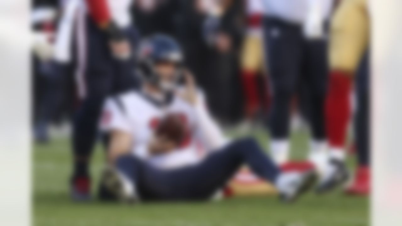 Houston Texans quarterback Davis Mills sits on the field after being tackled against the San Francisco 49ers during the second half of an NFL football game in Santa Clara, Calif., Sunday, Jan. 2, 2022.