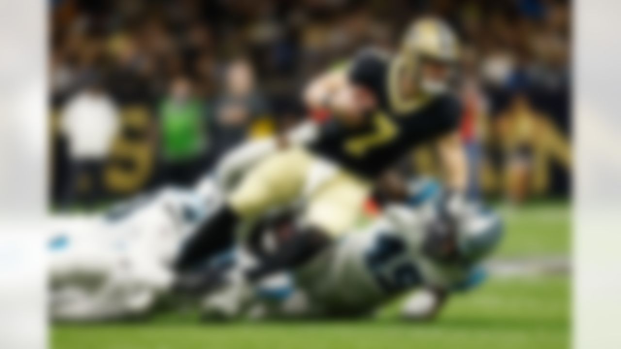 New Orleans Saints quarterback Taysom Hill (7) is brought down during an NFL football game against the Carolina Panthers on Sunday, January 2, 2022 in New Orleans, Louisiana.