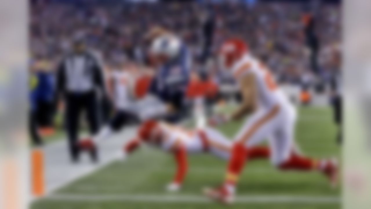 New England Patriots quarterback Tom Brady (12) is tackled just short of the goal line by Kansas City Chiefs defensive back Tyvon Branch (27) and free safety Husain Abdullah (39) in the first half of an NFL divisional playoff football game, Saturday, Jan. 16, 2016, in Foxborough, Mass. (AP Photo/Steven Senne)