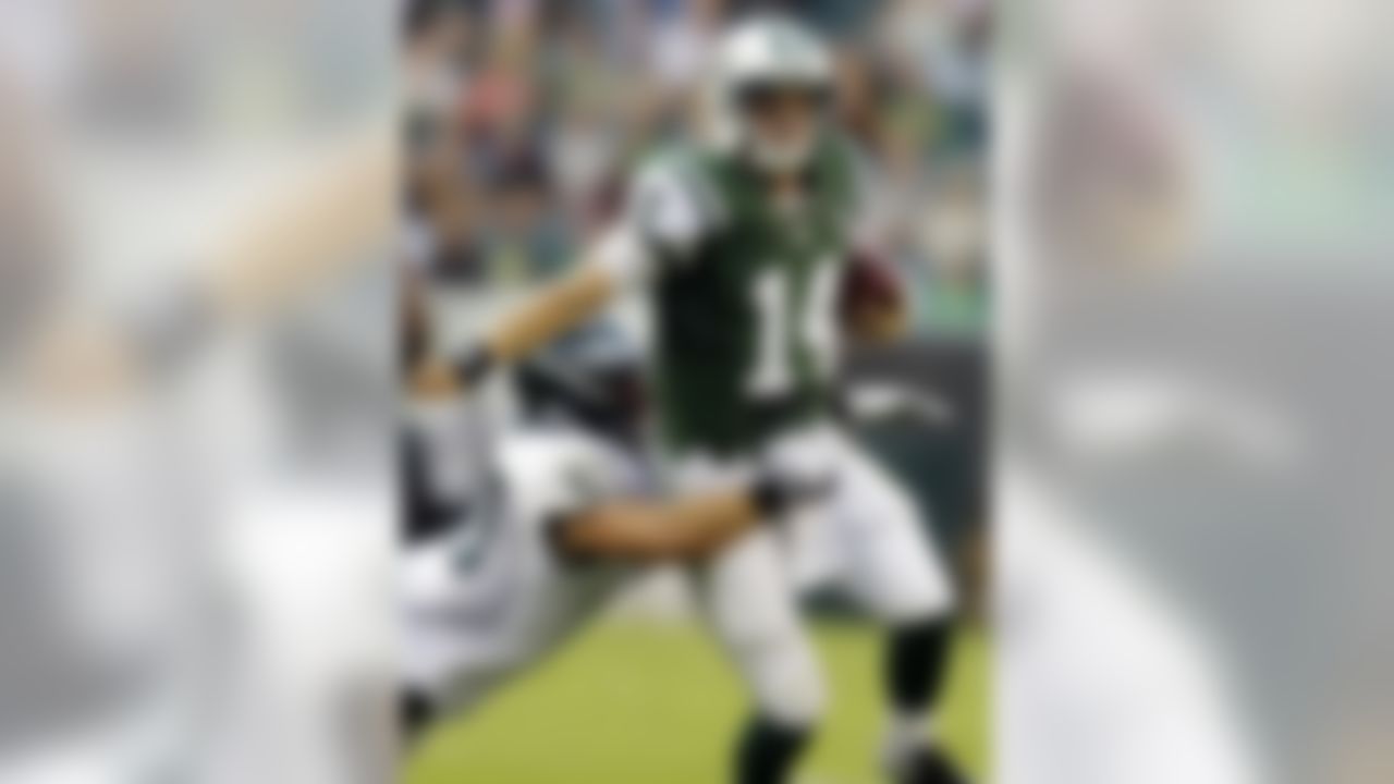 New York Jets quarterback Greg McElroy (14) is tackled by Philadelphia Eagles linebacker Ryan Rau in the first half of a preseason NFL football game, Thursday, Aug. 30, 2012, in Philadelphia. (AP Photo/Matt Rourke)