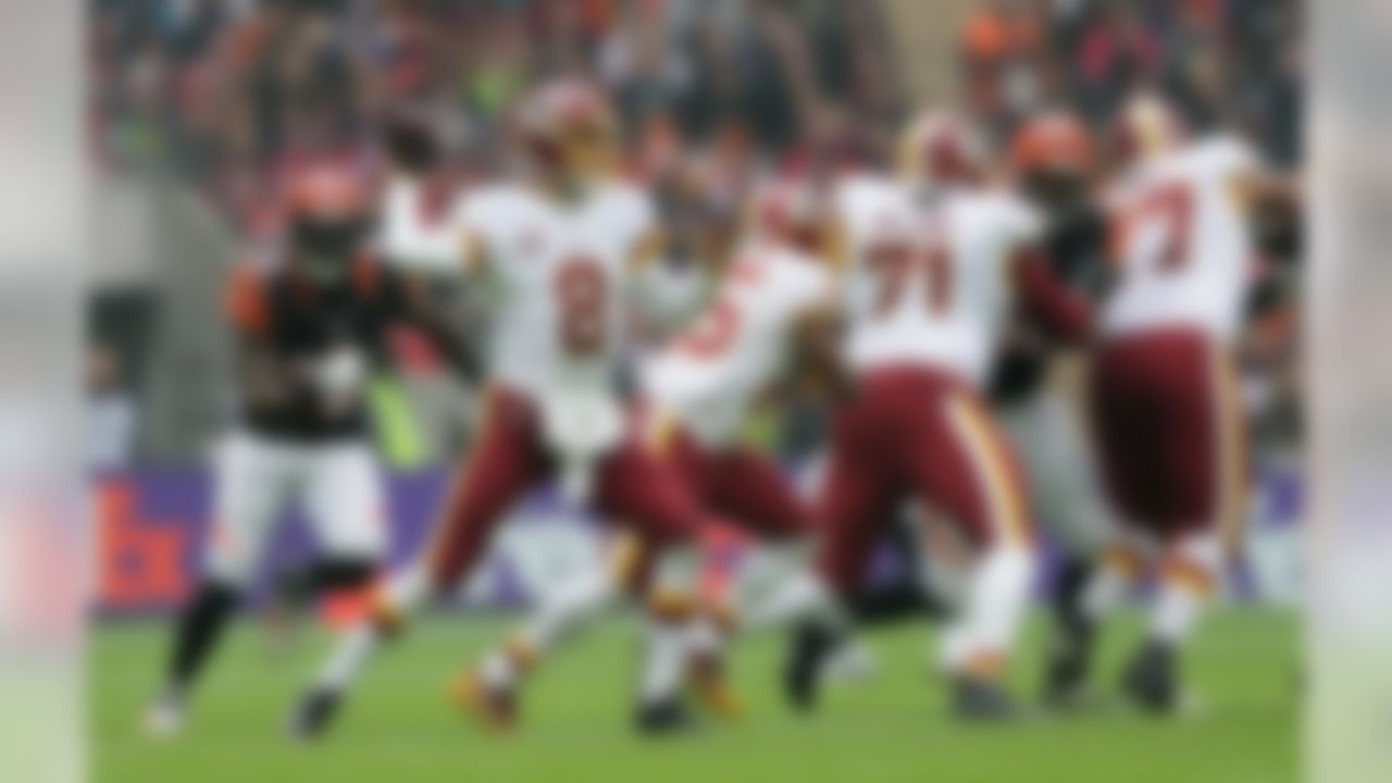Washington Redskins quarterback Kirk Cousins (8) passes the ball during an NFL Football game at Wembley Stadium in London, Sunday Oct. 30, 2016. (AP Photo/Matt Dunham)