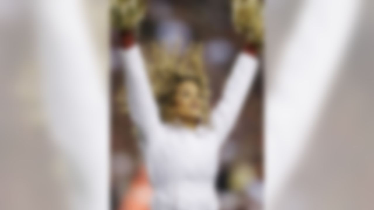 A Washington Redskins cheerleader performs during the first half of an NFL wild card playoff football game against the Seattle Seahawks in Landover, Md., Sunday, Jan. 6, 2013. (AP Photo/Matt Slocum)