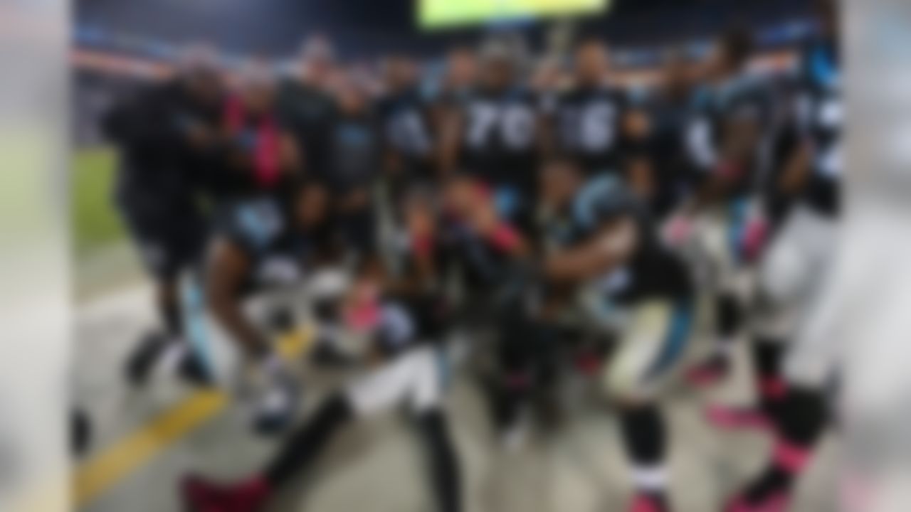 The Carolina Panthers offense celebrates on the sideline during an NFL football game against the Philadelphia Eagles at Bank of America Stadium on Sunday, October 25, 2015 in Charlotte. The Panthers defeated the Eagles 27-16. (Perry Knotts/NFL)