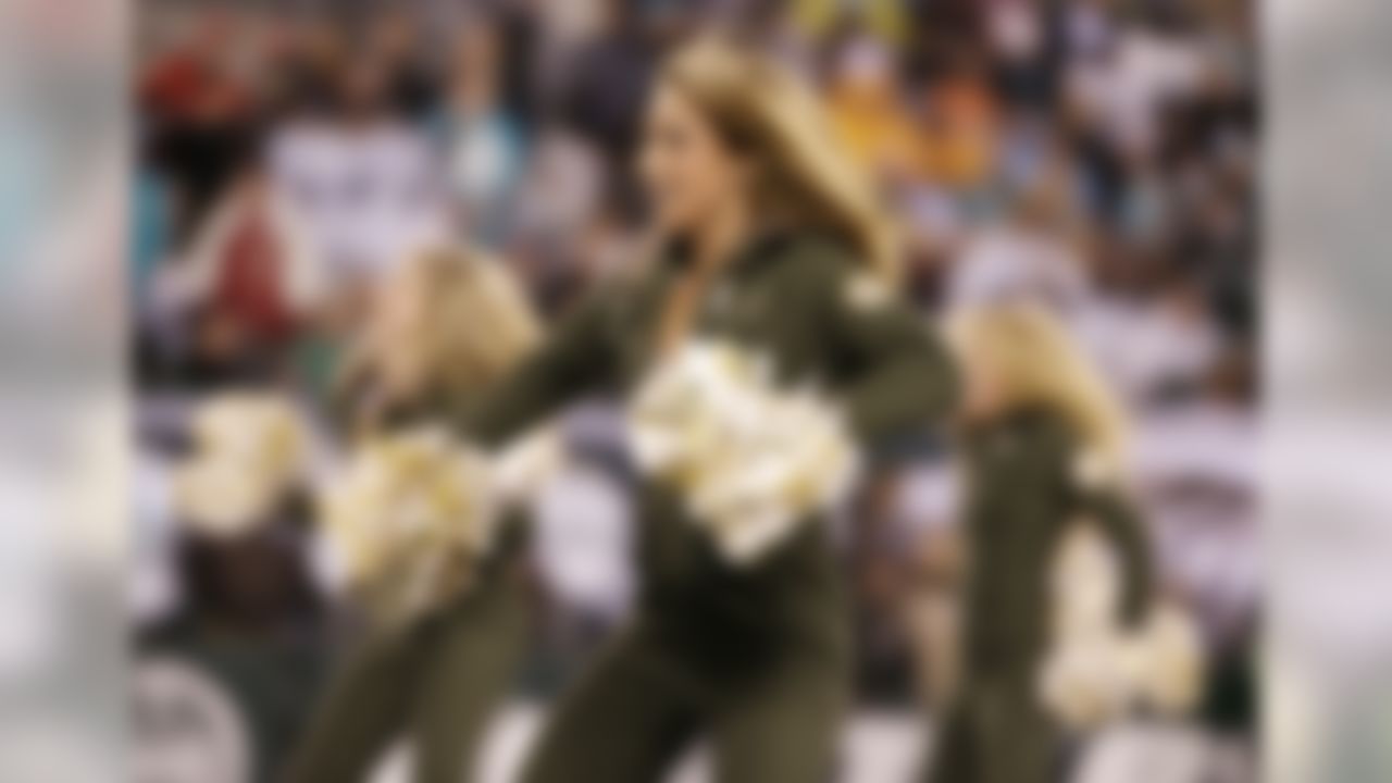 A New York Jets cheerleader performs during a timeout during the second quarter an NFL football game against the Miami Dolphins, Monday, Dec. 1, 2014, in East Rutherford, N.J. (AP Photo/Julio Cortez)