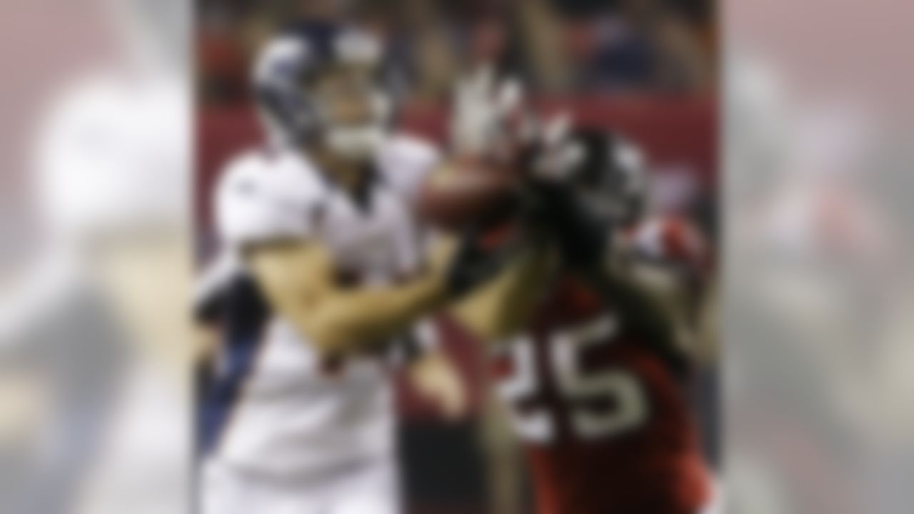 Denver Broncos wide receiver Brandon Stokley (14) makes a catch under the defense of Atlanta Falcons strong safety William Moore (25) during the second half of an NFL football game, Monday, Sept. 17, 2012, in Atlanta. (AP Photo/John Bazemore)