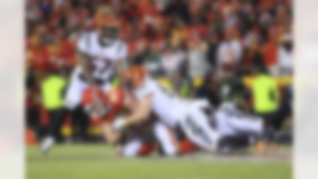 Cincinnati Bengals linebacker Logan Wilson (55) tackles Kansas City Chiefs tight end Travis Kelce (87) during an NFL Conference Championship playoff game on Sunday, January 29, 2023 in Kansas City, Missouri.