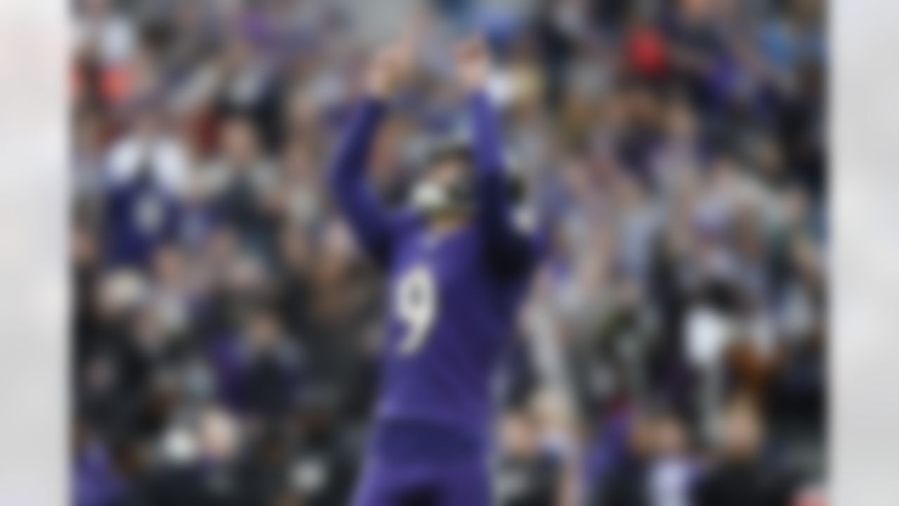 Baltimore Ravens kicker Justin Tucker reacts after kicking an extra point against the Los Angeles Rams during the first half of an NFL football game, Sunday, Jan. 2, 2022, in Baltimore.