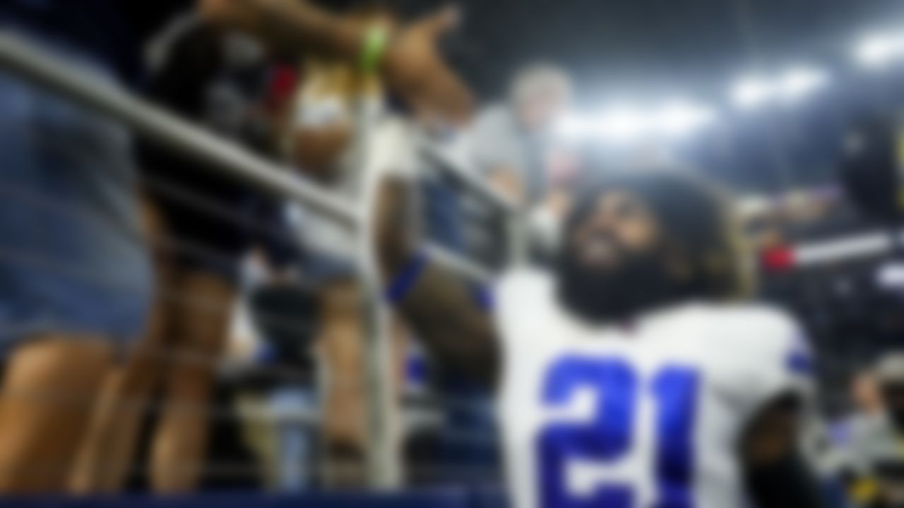 Dallas Cowboys running back Ezekiel Elliott (21) high fives fans after an NFL football game against the Philadelphia Eagles on Monday, September 27, 2021 in Arlington, Texas.