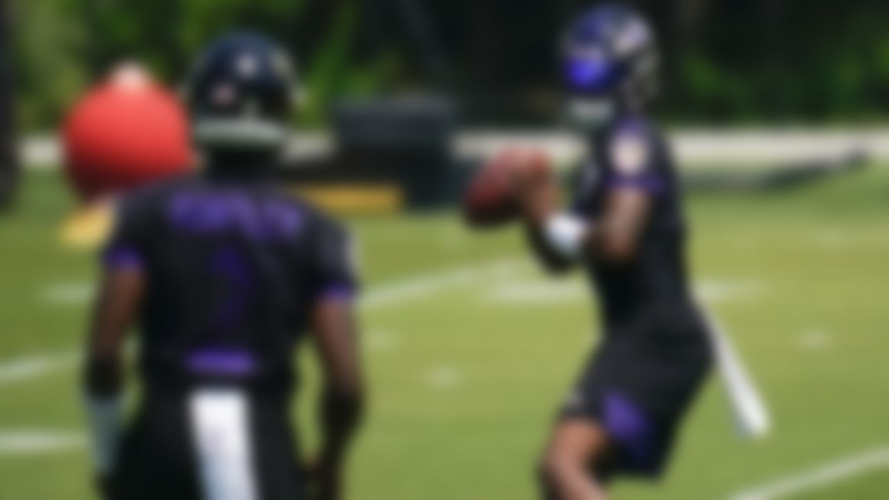 Baltimore Ravens quarterback Lamar Jackson, right, and quarterback Tyler Huntley (2) work out during the team's NFL football organized team activities, Wednesday, May 26, 2021, in Owings Mills, Md.