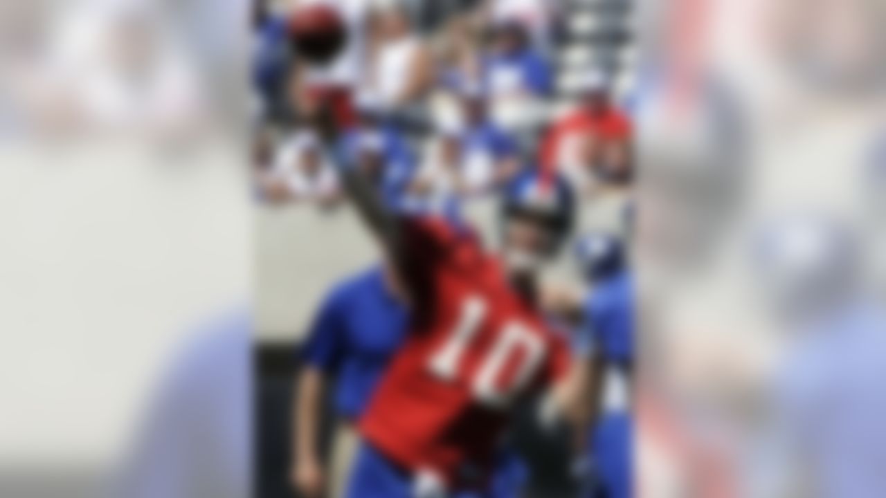 New York Giants quarterback Eli Manning throws a pass during football practice at the new Meadowlands Stadium, Tuesday, June 15, 2010, in East Rutherford, N.J. (AP Photo/Bill Kostroun)