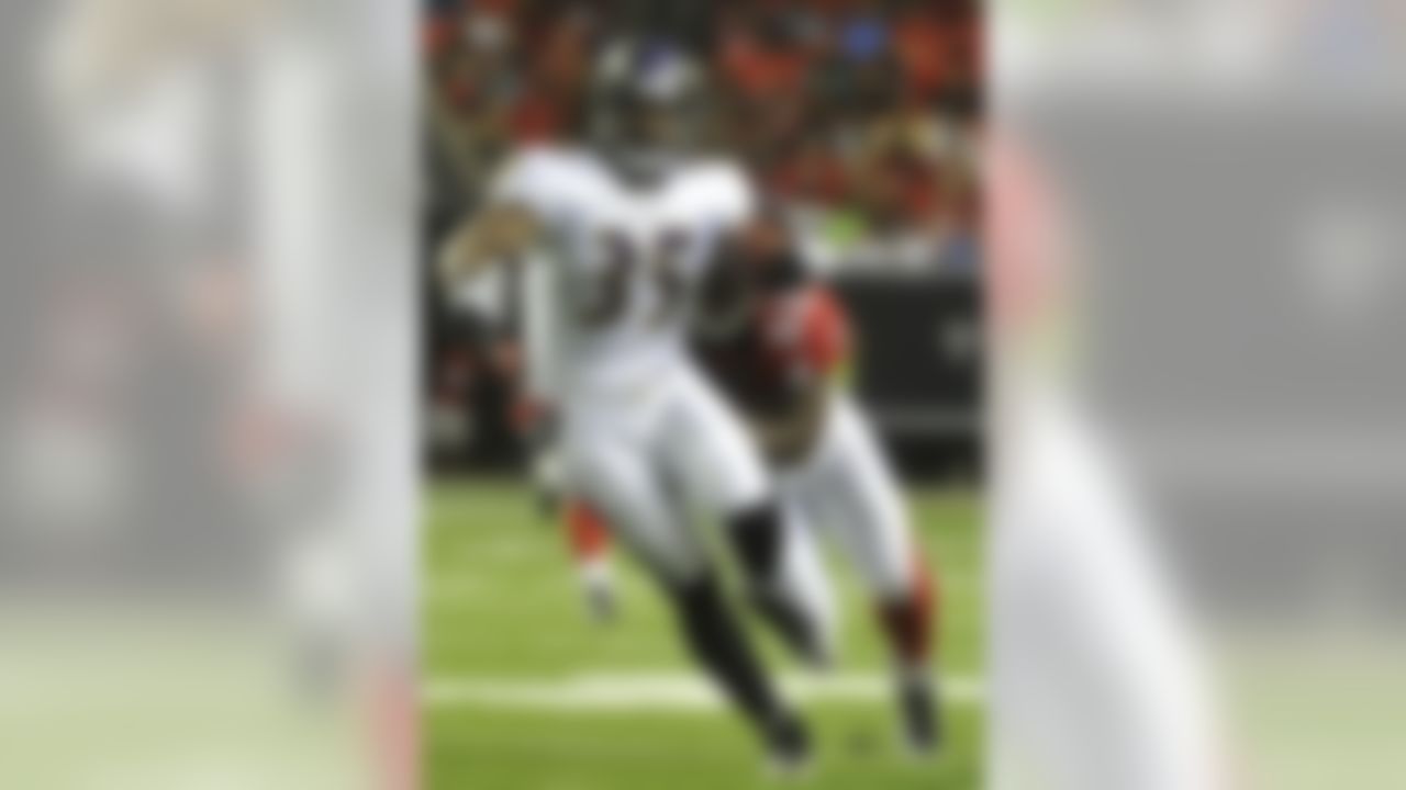 Baltimore Ravens running back Anthony Allen (35) runs in the grasp of Atlanta Falcons linebacker Curtis Lofton (50)during the first half of an NFL preseason football game on Thursday, Sept. 1, 2011, in Atlanta. (AP Photo/John Amis)