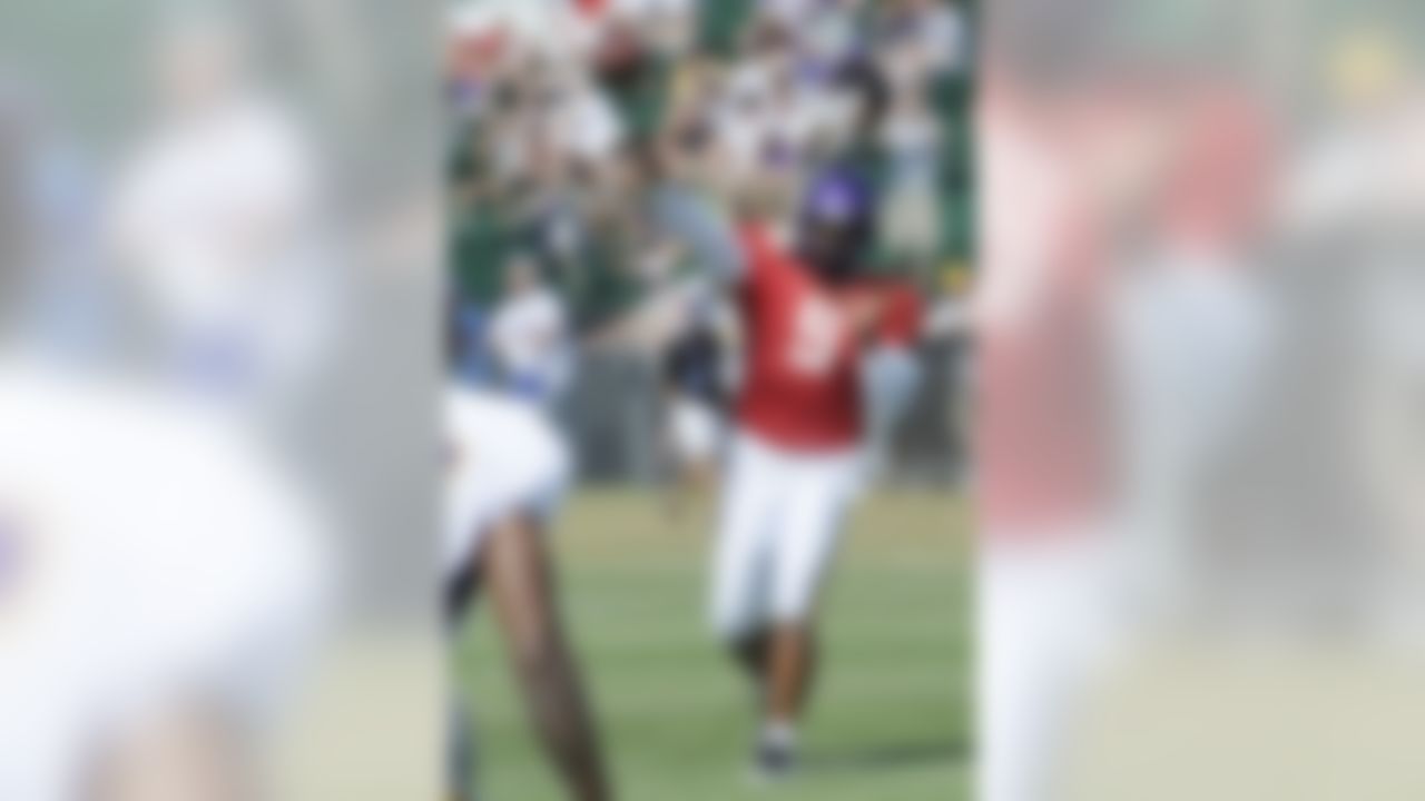 Minnesota Vikings quarterback Donovan McNabb throws a pass after the players union ratified the new collective bargaining agreement and free agents were allowed to participate in NFL football training camp, Thursday, Aug. 4, 2011, in Mankato, Minn. (AP Photo/Jim Mone)