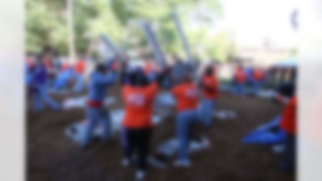 The Home Depot associates and KaBOOM! volunteers carrying one of the playground parts. (Photo by Tom Copeland/Home Depot)