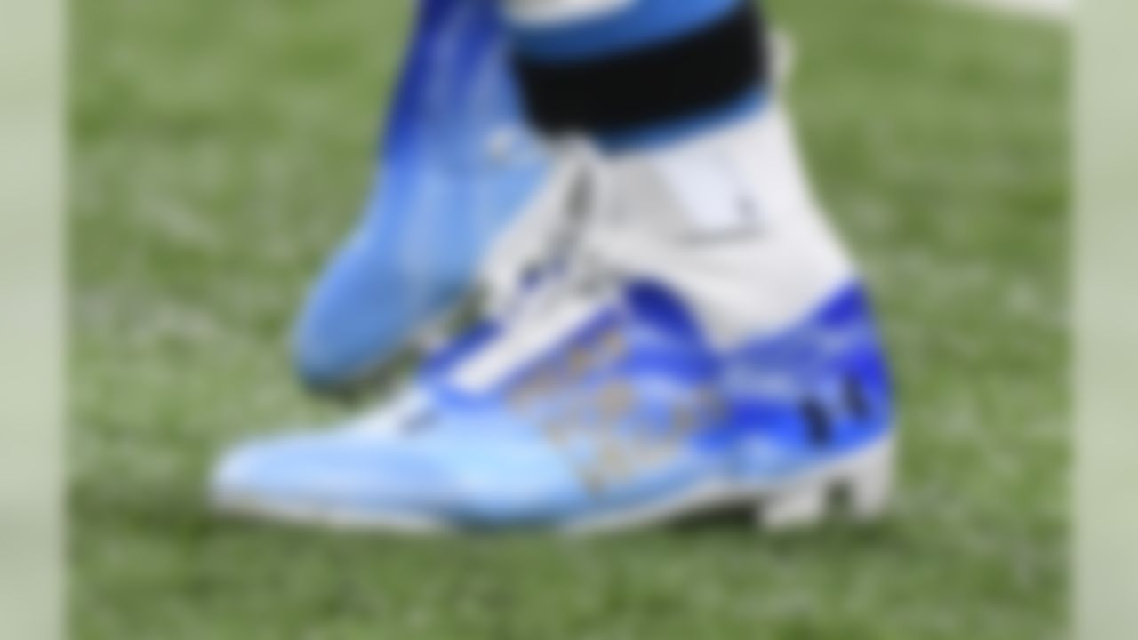 Carolina Panthers quarterback Cam Newton sports a Pray for Vegas version of an Under Armour cleat during warmups of an NFL football game against the Detroit Lions, Sunday, Oct. 8, 2017, in Detroit. (AP Photo/Jose Juarez)