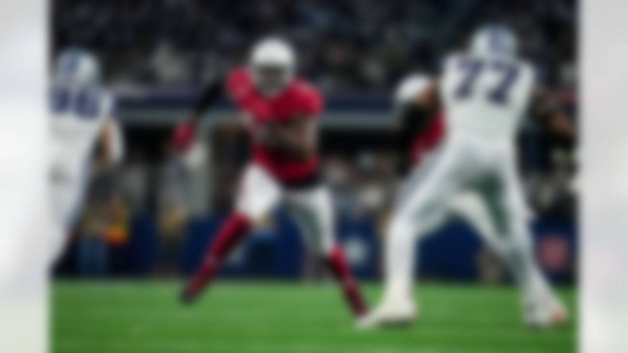 Arizona Cardinals defensive end Chandler Jones (55) scrambles to get around the block during an NFL football game against the Dallas Cowboys on Sunday, January 2, 2022 in Arlington, Texas.