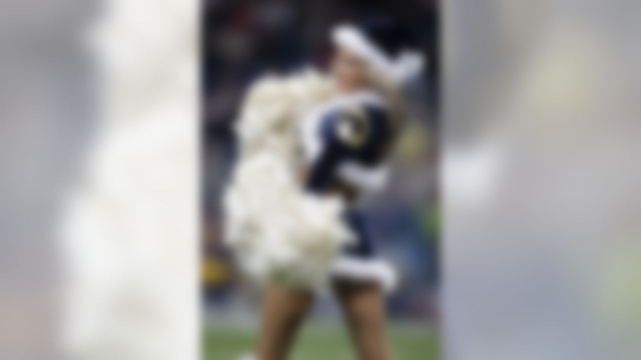 A St. Louis Rams cheerleader performs during the first quarter of an NFL football game between the Houston Texans and the St. Louis Rams Sunday, Dec. 20, 2009, in St. Louis. (AP Photo/Jeff Roberson)