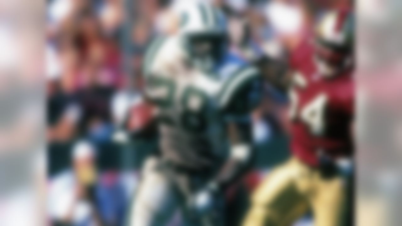The Jets present an offer sheet to Patriots running back Curtis Martin to switch teams after the 1997 season. In the contract was a "poison pill" that called for the Patriots to give Martin unrestricted free agency the following year if the Patriots matched the offer. Martin finished his Hall of Fame career with New York. (AP Photo/Greg Trott)