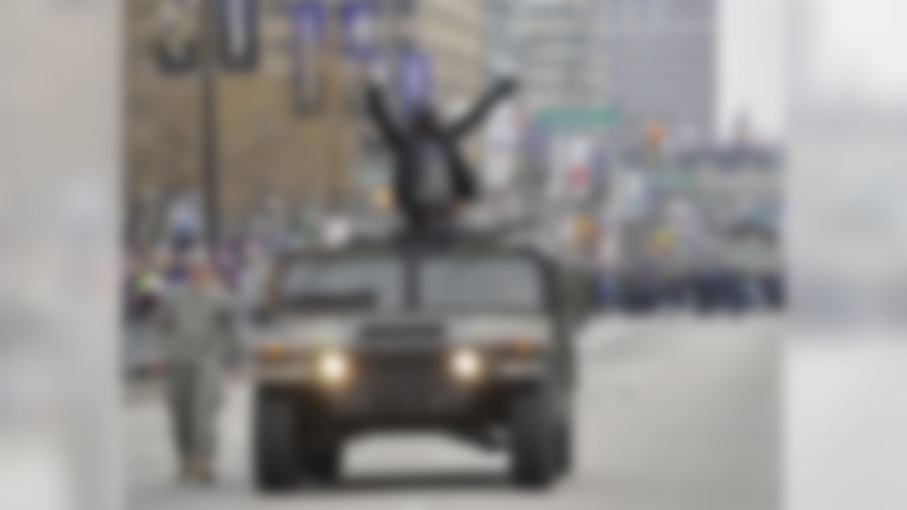 Baltimore Ravens safety Ed Reed greets fans while riding in a Humvee during the Ravens victory parade Tuesday, Feb. 5, 2013, in Baltimore. The Ravens defeated the San Francisco 49ers in NFL football's Super Bowl XLVII 34-31 on Sunday. (AP Photo/Gail Burton)