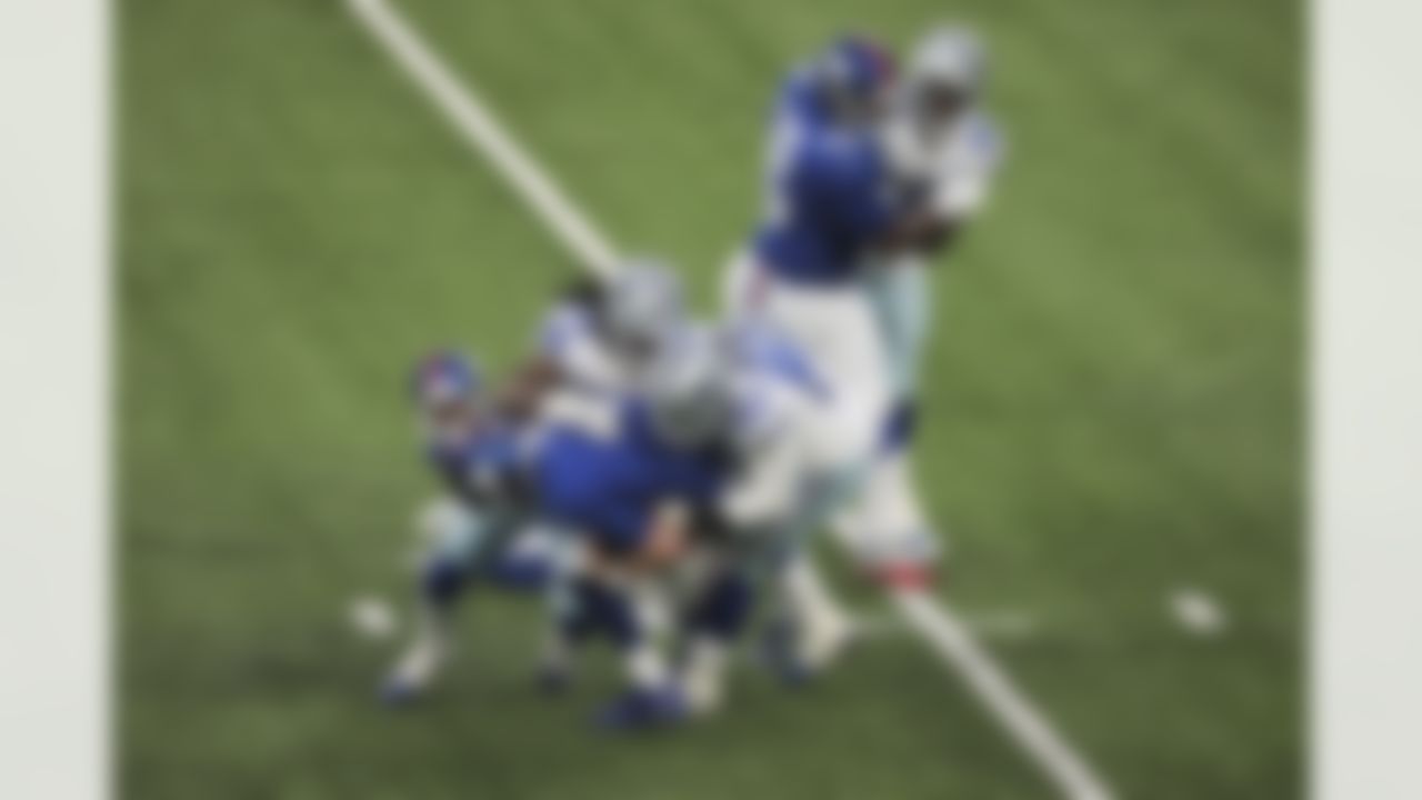 Dallas Cowboys defensive end DeMarcus Lawrence (90) and middle linebacker Jaylon Smith (54) sack New York Giants quarterback Daniel Jones (8) during an NFL football game on Sunday, January 3, 2021 in East Rutherford, New Jersey.