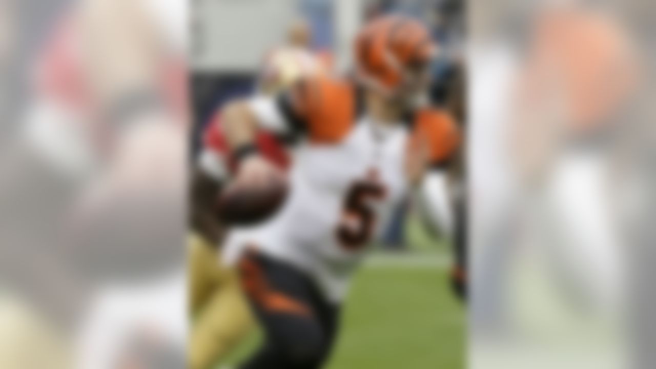 Cincinnati Bengals quarterback AJ McCarron (5) rolls out to pass against the San Francisco 49ers during the first half of an NFL football game in Santa Clara, Calif., Sunday, Dec. 20, 2015. (AP Photo/Eric Risberg)