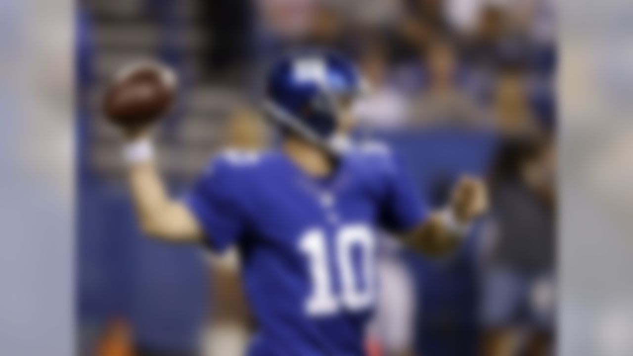 New York Giants quarterback Eli Manning throws during the first half of an NFL preseason football game against the Indianapolis Colts on Saturday, Aug. 16, 2014, in Indianapolis. (AP Photo/Darron Cummings)